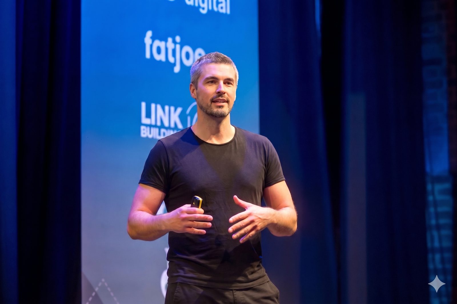 Tom Goodwin speaking on stage